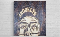 an image of a man in glasses with the word brooklyn on it